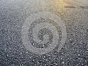 The sunlight in the front of the empty asphalt road background