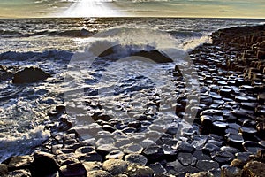 Sunlight highlighting the hexagonal Basalt slabs of Giants Causeway