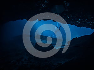 Sunlight illuminating the underwater cavern entrance in the sinkhole at Blue Grotto, Florida