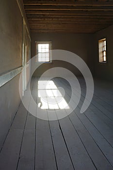 Sunlight pouring through window in empty room