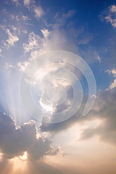 Sunlight rays and clouds on the sky