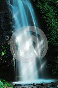 Sunlight rays on waterfall