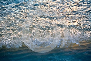 The sunlight that is reflected in the sea water