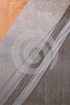 Sunlight and shadow on gray and brown pattern with rough texture of concrete wall background