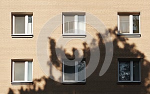 Sunlight and Shadows on Tan Brick Building Facade