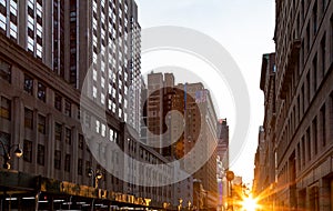 Sunlight shines between the buildings along 34th Street in Midtown Manhattan, New York City