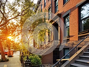 Sunlight shines on the cobblestones of Harrison Street in the Tribeca neighborhood of Manhattan in New York City