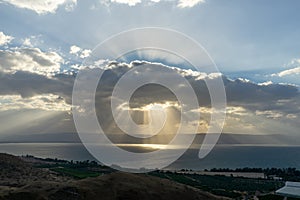 Sunlight shinning on the sea through the rain clouds. Sea of Galilee