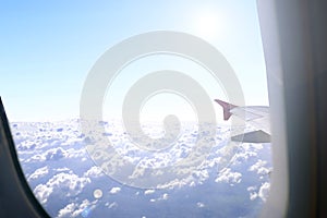 Sunlight and skyline from airplane window view