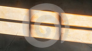 Sunlight streaming through a window, casting shadows and highlighting the texture of the wall.