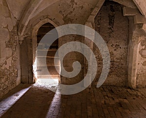 Sunlight Streamng through old Door of England's Lacock Abbey