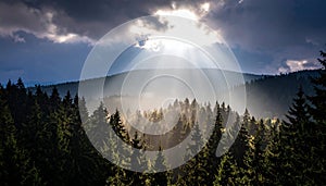 Sunlight streams through a break in the clouds