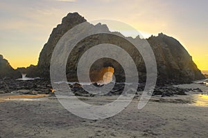 Sunlight streams through Keyhole / Keystone Arch, Pfeiffer Beach