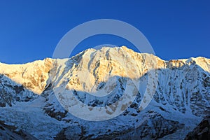 Sunlight on summit of Annapurna Mountain Range