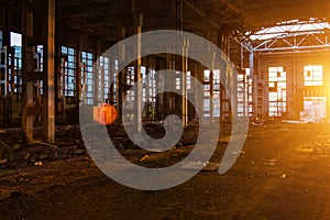 Sunlight of sunset in large abandoned industrial building of Voronezh excavator factory