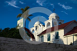 Sunlit church of Flores with basketball field, Peten, Guatemala