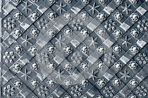Sunlit decorative metal gate. Pattern on metal. Abstract background