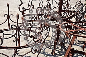 Sunlit Rusty Wrought Iron Tables.