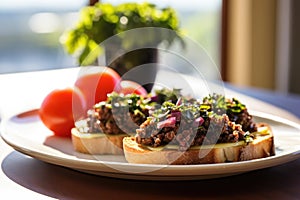 sunlit side view of tapenade bruschetta plate on breakfast table