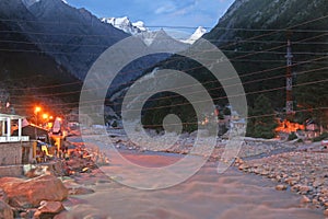 Sunlit snow peaks on town of gangotri India