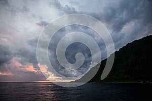 Sunlit Storm Clouds and Remote Island