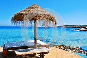 Sunlounger and umbrella in Ibiza Island, Spain