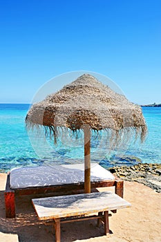 Sunlounger and umbrella in Ibiza, Spain