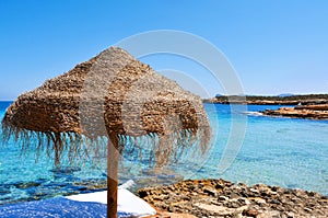 Sunlounger and umbrella in Ibiza, Spain