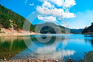 Sunnet Lake, Green and blue water and blue sky, Mountain Forests at the far end, Bolu, Turkey