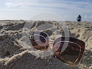 Sunnies and metal detector guy