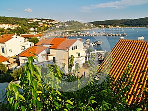 Sunny afternoon in Kampor village with a bay on island Rab, Croatia