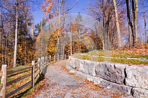 Sunny autumn day view along the pathway on Humber Valley Heritage Trail near Kleinburg, Ontario, Canada photo