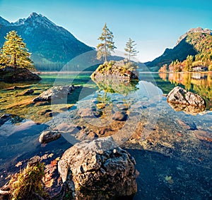 Sunny autumn scene of Hintersee lake. Colorful morning view of Bavarian Alps on the Austrian border, Germany, Europe. Beauty of