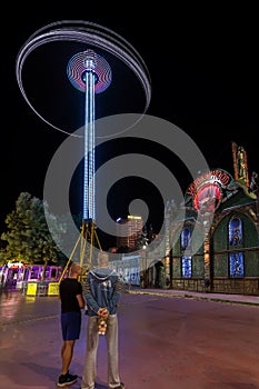 SUNNY BEACH, BULGARIA - September 10, 2017: Attraction in the park. Roller coaster in motion at night. A long exposure photo