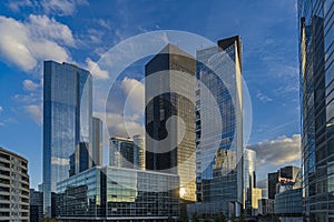 Sunny and Cloudy Sunset Over La Defense Business District Buildings Reflections