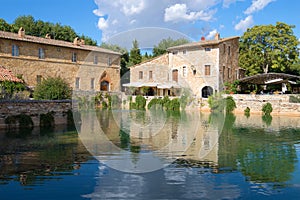 A sunny day by the ancient thermal pool in Bagno Vignoni. Tuscany, Italy