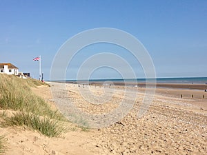 A sunny day on the beach at Camber Sands East Sussex photo