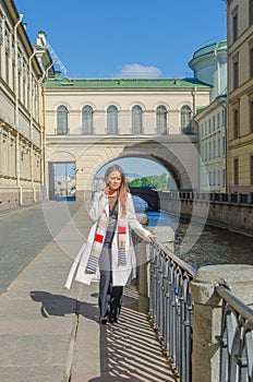 Sunny day, beautiful girl on the waterfront