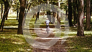 Sunny Day Bike Ride: Boy's Adventure in the Vibrant City Park