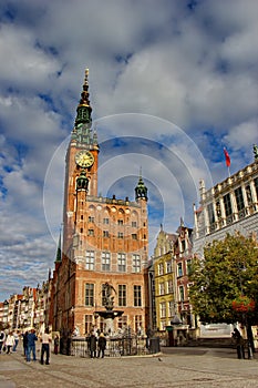 Sunny day on Dluga street, view on city hall of Gdansk