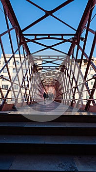 Sunny Day in The Eiffel Bridge on the Onyar River at dusk in Girona, Catalonia Spain