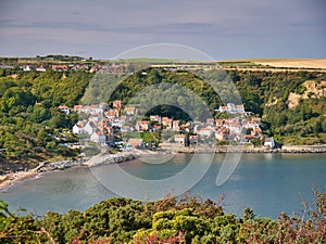 On a sunny day at the end of summer, an aerial view of Runswick Bay on the North Yorkshire coast in England, UK