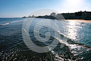 Sunny day in January with sun shining over the sea in Larnaca