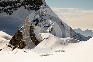 Sunny day, mountain peaks, snow and glaciers on Jungfraujoch, Interlaken, Switzerland