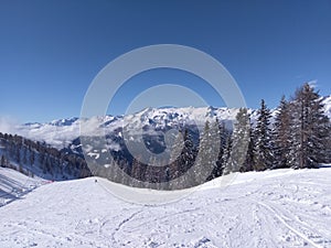 sunny day at ski slopes near Madonna di Campiglio