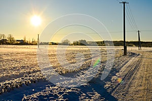 Sunny day on a snowy field in Estonia