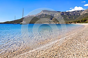 Sunny day summer beach seascape near greek village Kiparissi, Lakonia, Peloponessos.