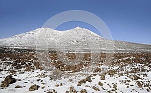 Sunny day with vistas towards Pico Viejo and Pico del Teide covered in snow in Teide National Park, Tenerife, Canary Islands