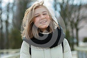 Sunny day young smiling adorable woman having fun during city park strolling. Lifestyle positive emotions concept.