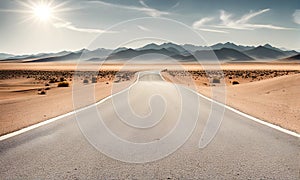 Sunny desert landscape with an asphalt road